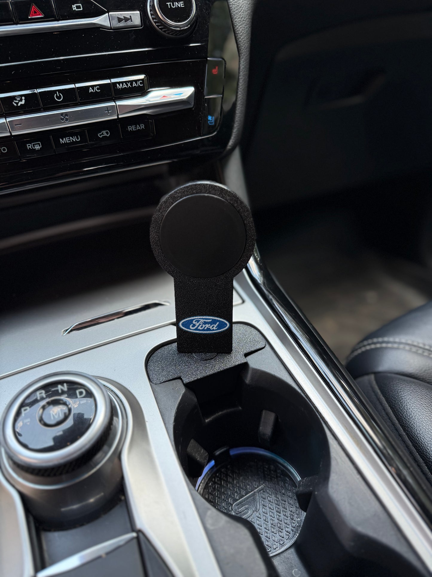 MagSafe wireless car charger mount showing Ford design